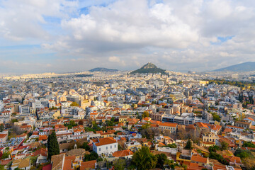 Fototapeta na wymiar View of the Plaka and Monastiraki districts and Mount Lycabettus from the Acropolis on Acropolis Hill in Athens, Greece, on an overcast autumn day.