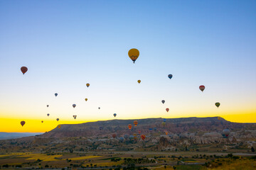 Cappadocia background photo. Hot air balloons on the sky at sunrise