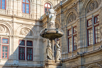 Fototapeta na wymiar Fountain at Vienna State Opera, Austria