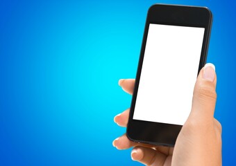 Human hand holding a phone with a blank screen