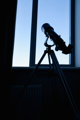 the telescope is near the window
