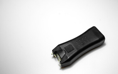 Compact stun gun in black on white isolate.A device for self-defense.