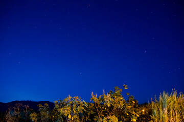 Low exposure speed night photography, clear sky and stars on the horizon.