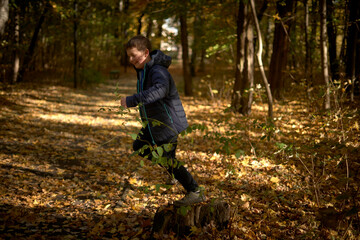 Boy and autumn in park