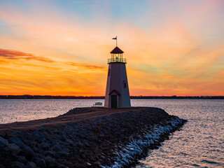 Fototapeta na wymiar Sunset beautiful landscape of the Lake Hefner lighthouse