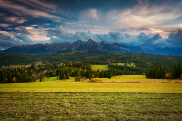 Beautiful sunset on the meadow under the Tatra Mountains at autumn. Poland