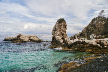 Fototapeta na wymiar View of the stony coast of the Ionian sea on the islands of Corfu