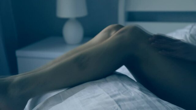 Sexy woman bed. Bedroom. Sensual woman legs. Erotica.