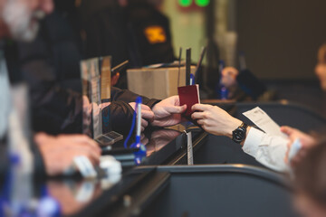 Process of checking in on a conference congress forum event, registration desk table, visitors and attendees receiving a name badge and entrance wristband bracelet and register electronic ticket,