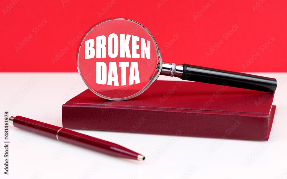 Poster On a white and red background, a notebook, a pen and a magnifying glass, inside which the inscription - Broken Data