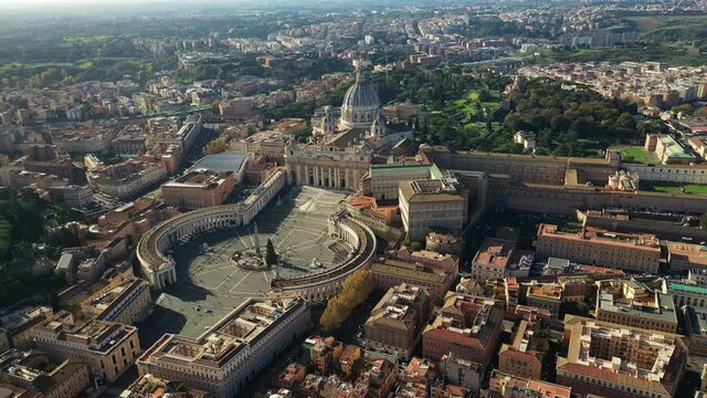 Aerial drone video of Saint Peter's gardens of world's largest church -Basilica of St. Peter's, Vatican and iconic Capella Sistine, Rome, Italy