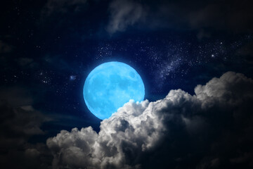 Naklejka na ściany i meble Full Moon with stars breaking through the clouds.