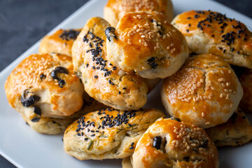 Turkish style pastry with olives and dill cheese pastry (Turkish name; Zeytinli pogaca ve dere otlu peynirli pogaca)