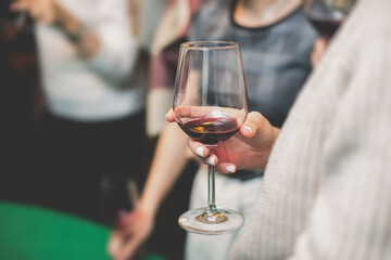 Process of wine testing at vineard, friends having fun drinking wine at winery