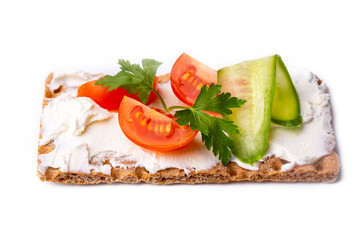Fresh rye crispbread with cream cheese and vegetables isolated on white