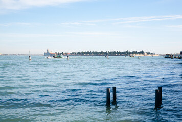 Venice typical landscape. Boat floating on canal. Italian landmark.