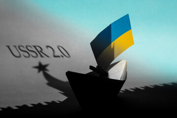 paper ships with flag of of Ukraine and Kremlin star Russia, relationships war conflict between the...