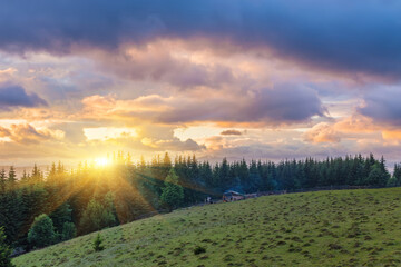 Naklejka na ściany i meble Mountain valley during sunrise. Natural landscape