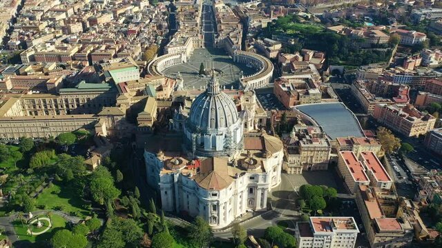 Aerial drone video of Saint Peter's gardens of world's largest church -Basilica of St. Peter's, Vatican and iconic Capella Sistine, Rome, Italy