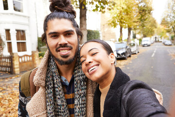 Portrait of couple in street in autumn