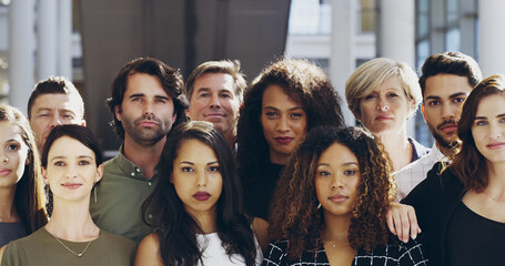 Confidence and teamwork. Cropped shot of a group of businesspeople standing in their workplace.