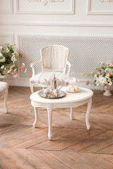 lunch time. vintage plate with marshmallows on a white table near the window in a classic interior near white wall background. free space	
