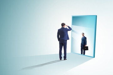 Young businessman in alter ego concept