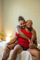 Smiling male couple hugging