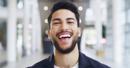 Fototapeta premium My time is coming. Cropped shot of a young handsome businessman in a modern office.