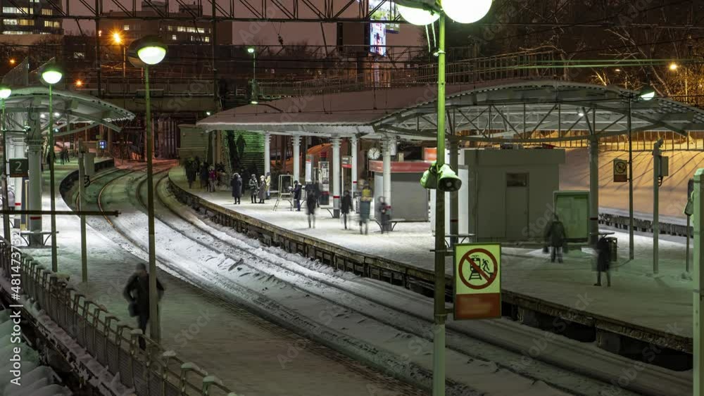 Wall mural Arrival and departure of suburban trains to the station platform, time lapse