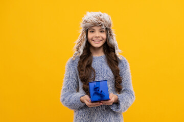 teen girl in knitwear on yellow background. child buy gift. black friday discount.