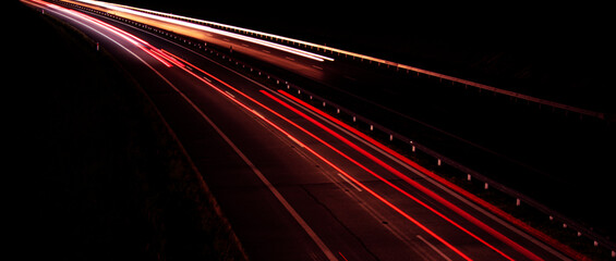 Night road lights. Lights of moving cars at night. long exposure red, blue, green, orange.