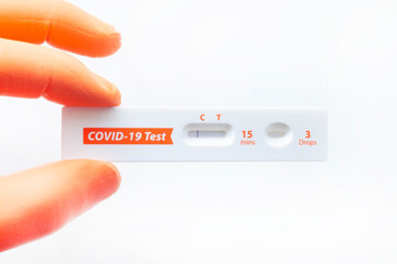 COVID-19 Self test detection bar in man hand