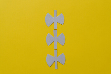 Fototapeta premium three unique paper shapes on yellow