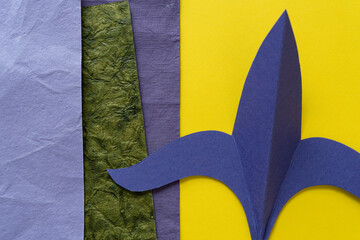paper fleur-de-lis or fleur-de-lys shape in purple and yellow