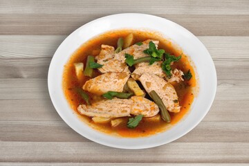 Thai dish with chicken, eggs, spicy, curry paste, tomatoes in a bowl