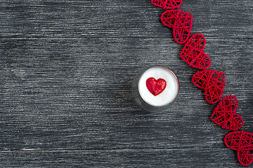 one cup of coffee with a red heart on a black and white background