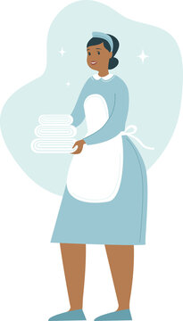 Maid Holding Towels. Housekeeper with a stack of clean linens. Cleaning service at the hotel. Woman in Housekeeping uniform.