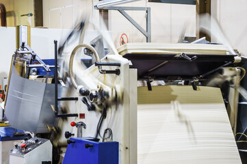 A printing houses. Machine for embossing of printed products. Embossing foil.