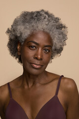 Studio portrait of mature woman