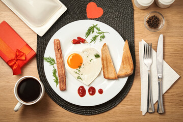 Festive breakfast surprise for Valentine's Day. The inscription "I love you" on the plate is made of food.