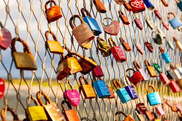 Colorful relationship locks on a fence