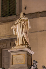Fototapeta premium Marble statue of Santa Margherita in the square of Cortona in front of the church. The Saint, proclaimed Co-patroness of Cortona together with San Marco. Cortona Tuscany Italy