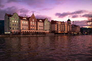 Colored houses on the central embankment at sunset in Kaliningrad.