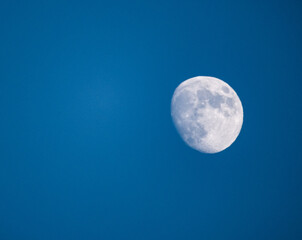 full moon over blue sky