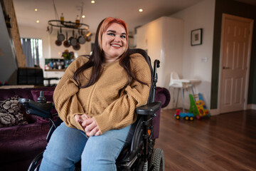 Portrait of smiling woman on wheelchair in living room