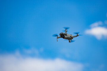 drone in flight in the blue sky 