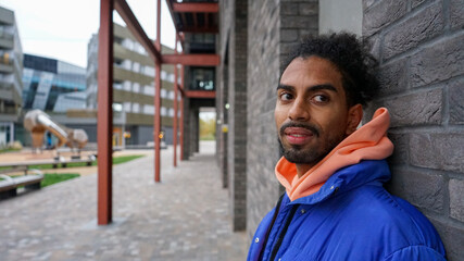 Portrait of young man wearing blue puffer jacket © Cultura Creative