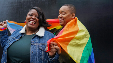 Two women with pride flag