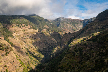 Fototapeta na wymiar Panoramic view of the terraced fields in the valley of Ponta do Sol, destination of one of the most beautiful levada hikes on the south coast of Madeira